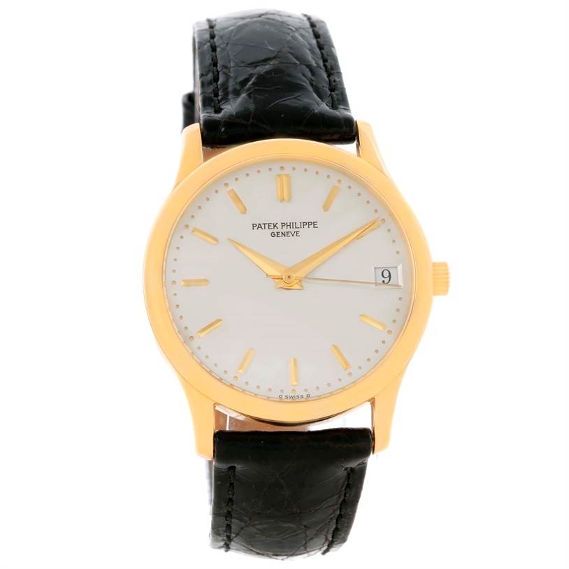 This image shows a front view of a Patek Philippe Calatrava 3998 Men's Yellow Gold Silver Dial 3998 Men's Yellow Gold Silver Dial watch with a gold case, white dial, date window, and black leather strap.