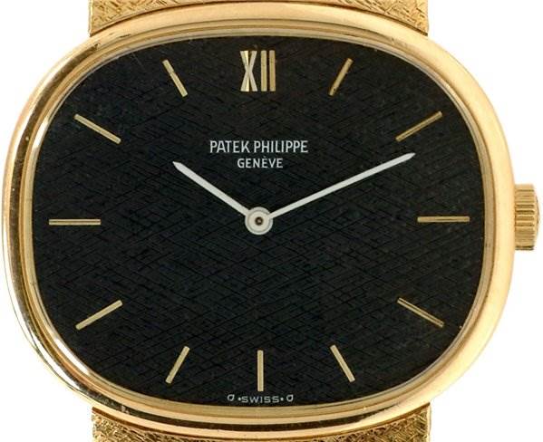 The image shows the front view of a Patek Philippe 3845/2 YEAR 1978 Yellow Gold Black Dial 3845/2 YEAR 1978 Yellow Gold Black Dial Vintage Men 18k y Gold Ellipse 3845/2 Year 1978 model, highlighting the dial and hands.