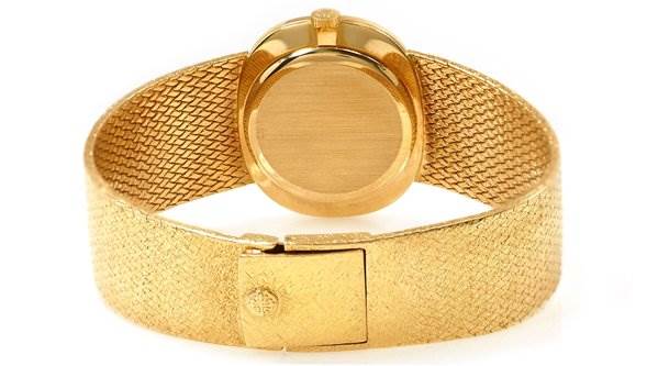 The image shows the back of the Patek Philippe 3845/2 YEAR 1978 Yellow Gold Black Dial 3845/2 YEAR 1978 Yellow Gold Black Dial Vintage Men 18k Gold Elipse 3845/2 Year 1978 watch, highlighting its clasp and wristband.