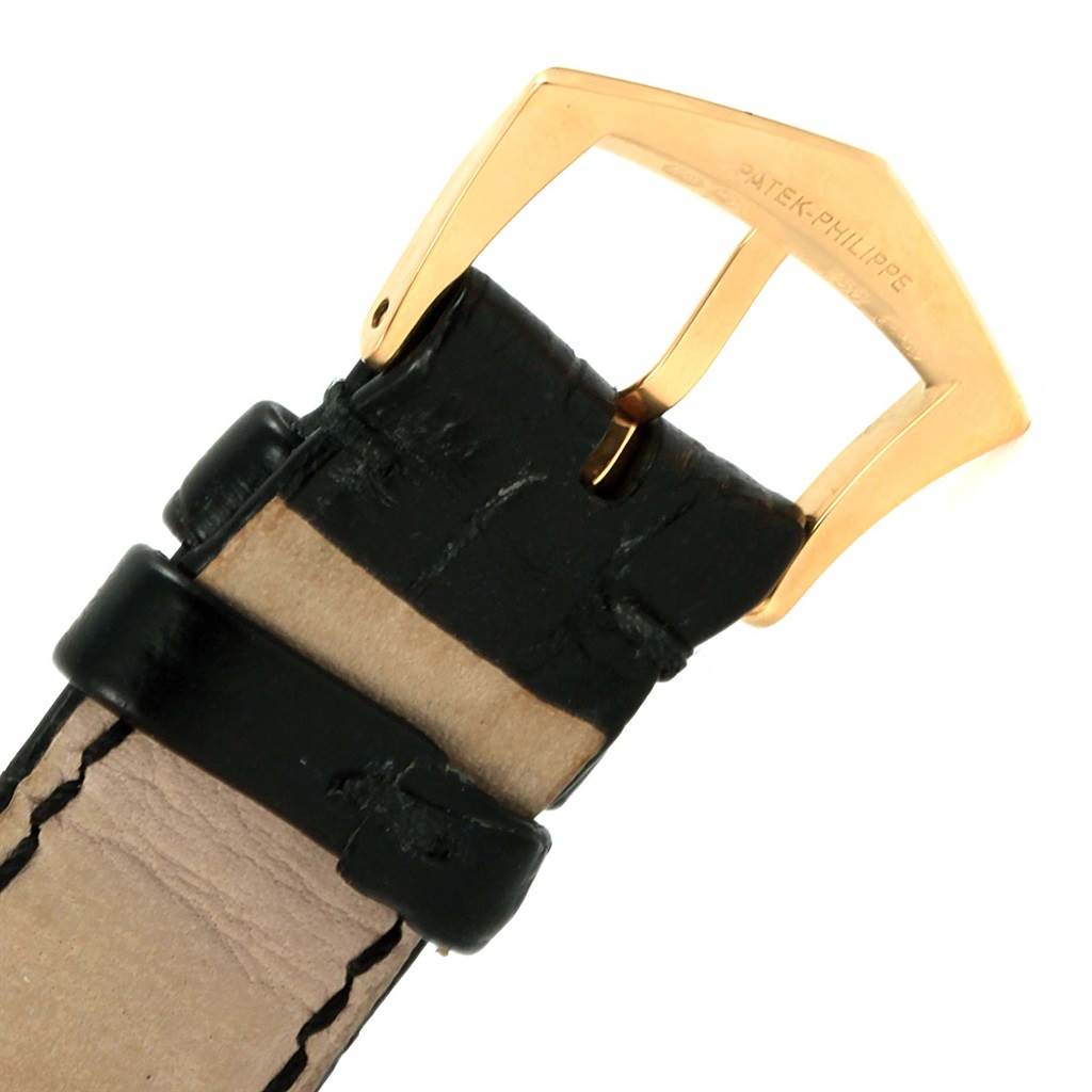 The image shows a close-up of the buckle and strap of a Patek Philippe Calatrava 5120J Men's Yellow Gold White Dial 5120J Men's Yellow Gold White Dial watch.