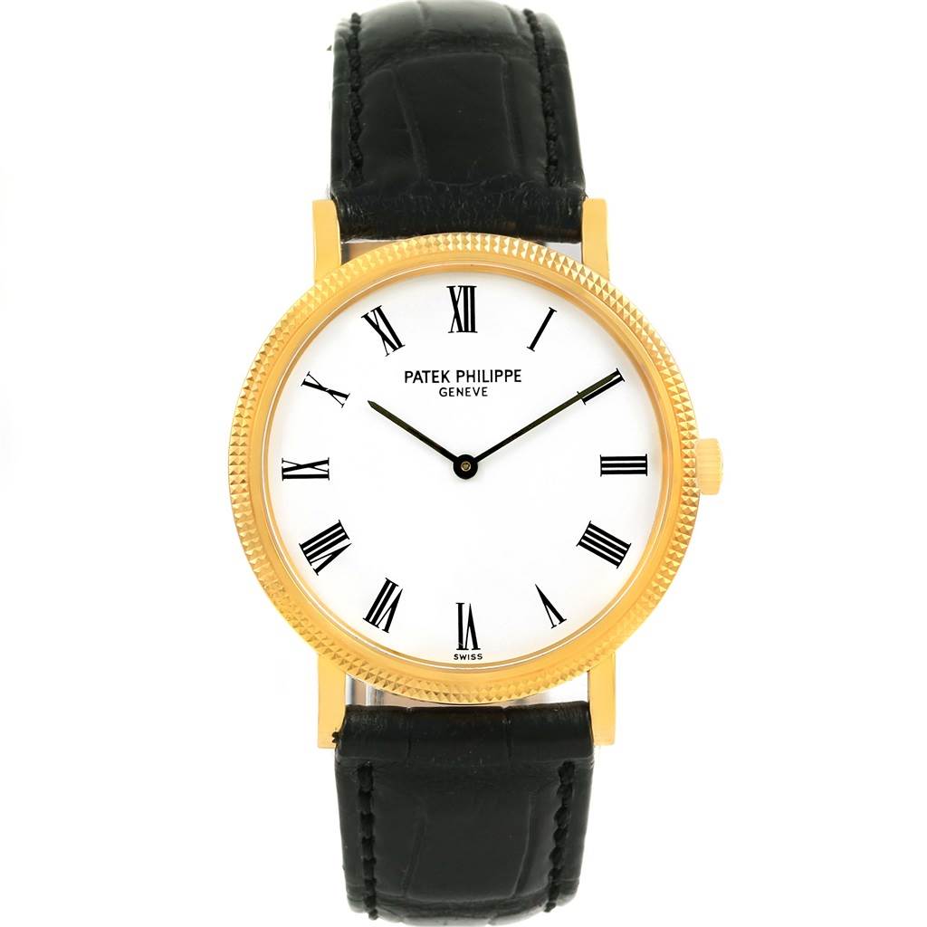 This is a front view of a Patek Philippe Calatrava 5120J Men's Yellow Gold White Dial 5120J Men's Yellow Gold White Dial watch displaying the face, bezel, crown, and black leather strap.