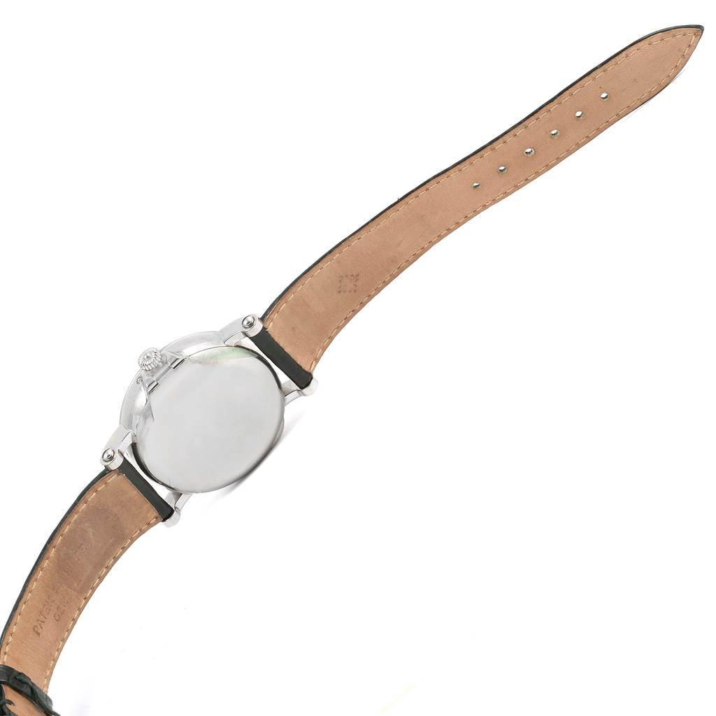 The image shows the back view of a Patek Philippe 5059 Men
s White Gold White Dial 5059 Men
s White Gold White Dial Perpetual Calendar Retrograde 18k White Gold Watch 5059, displaying its leather strap and case back.