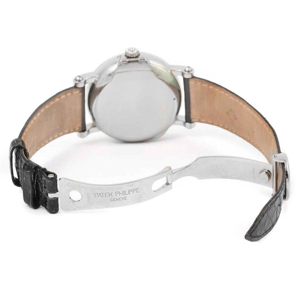 This image shows the back of a Patek Philippe 5059 Men
s White Gold White Dial 5059 Men
s White Gold White Dial Perpetual Calendar Retrograde 18k White Gold Watch 5059 with an open leather strap and clasp.