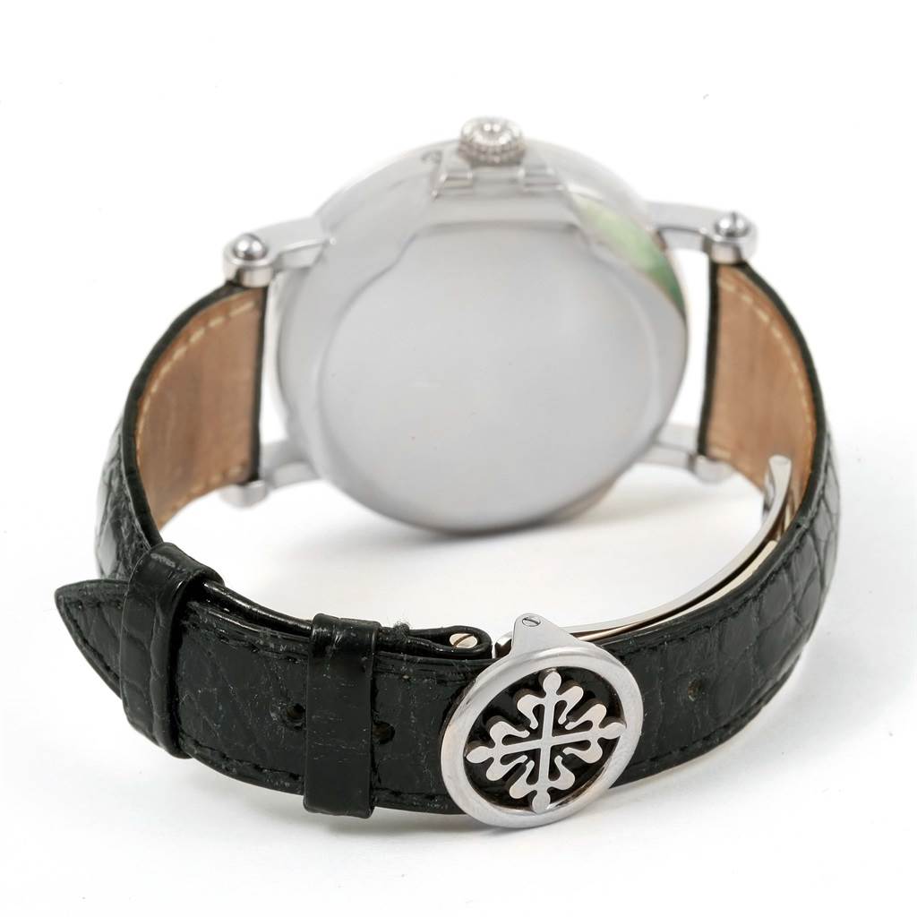 The image shows the back view of a Patek Philippe 5059 Men
s White Gold White Dial 5059 Men
s White Gold White Dial Perpetual Calendar Retrograde 18k White Gold Watch 5059, including the case and black leather strap.