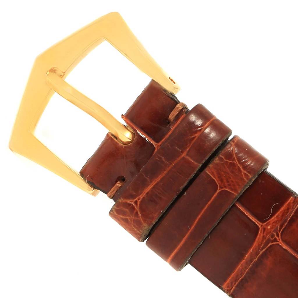 The image shows the brown leather strap and gold buckle of a Patek Philippe Calatrava 3919 Men's Yellow Gold White Dial 3919 Men's Yellow Gold White Dial watch.