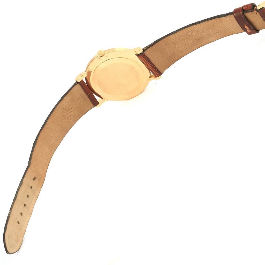 This image shows the back view of the Patek Philippe Calatrava 3919 Men's Yellow Gold White Dial 3919 Men's Yellow Gold White Dial watch with its leather strap fully extended.