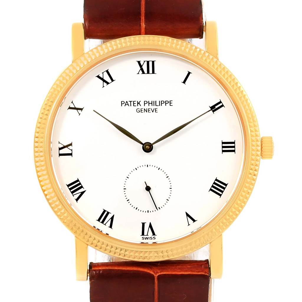 The front view of the Patek Philippe Calatrava 3919 Men's Yellow Gold White Dial 3919 Men's Yellow Gold White Dial watch displays its round gold bezel, white dial, Roman numeral markers, and brown leather strap.