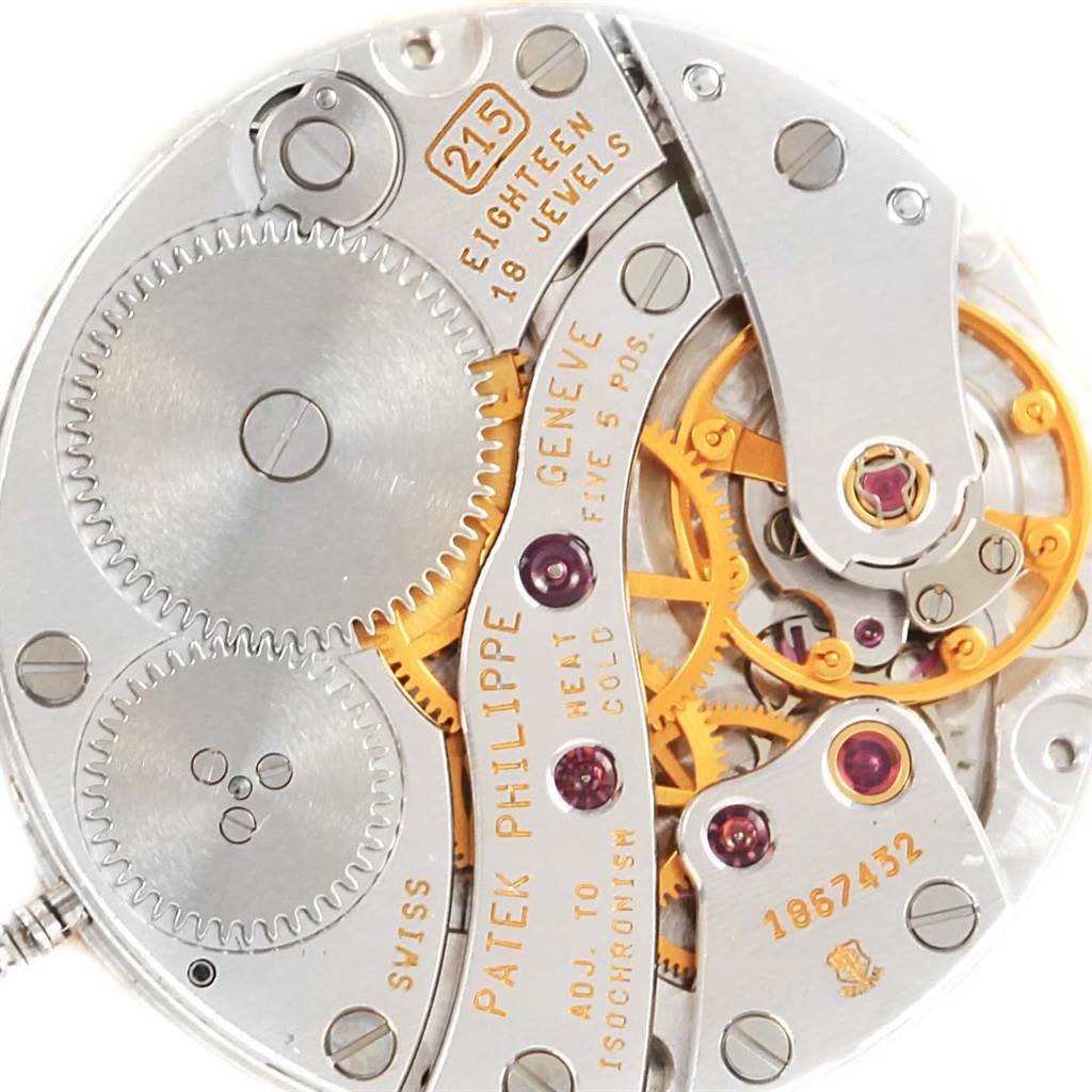 This is a close-up view of the movement mechanism of a Patek Philippe Calatrava 3919 Men's Yellow Gold White Dial 3919 Men's Yellow Gold White Dial watch, highlighting the gears and jewel settings.