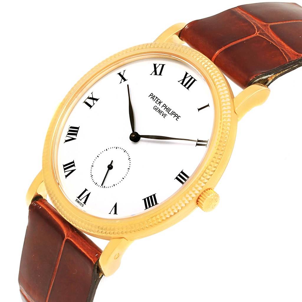 This image shows a Patek Philippe Calatrava 3919 Men's Yellow Gold White Dial 3919 Men's Yellow Gold White Dial watch at an angled view, highlighting the dial, Roman numerals, case, crown, and leather strap.