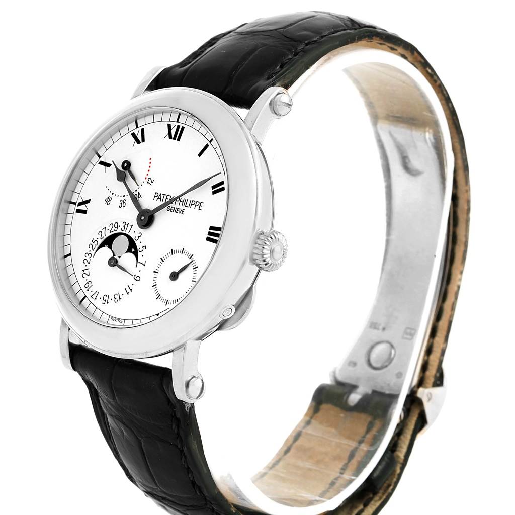 This Patek Philippe Complications 5054 Men's White Gold White Dial 5054 Men's White Gold White Dial model watch is shown at a 45-degree angle, displaying its face, crown, and black leather strap.