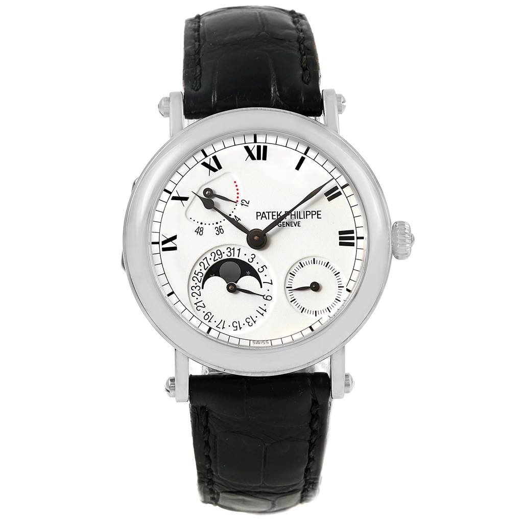 The image shows a front view of the Patek Philippe Complications 5054 Men's White Gold White Dial 5054 Men's White Gold White Dial watch, highlighting the dial, hands, subdials, and leather strap.
