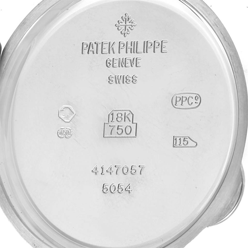 This image shows the inner caseback of the Patek Philippe Complications 5054 Men's White Gold White Dial 5054 Men's White Gold White Dial model watch, displaying the brand's engraving and material details.