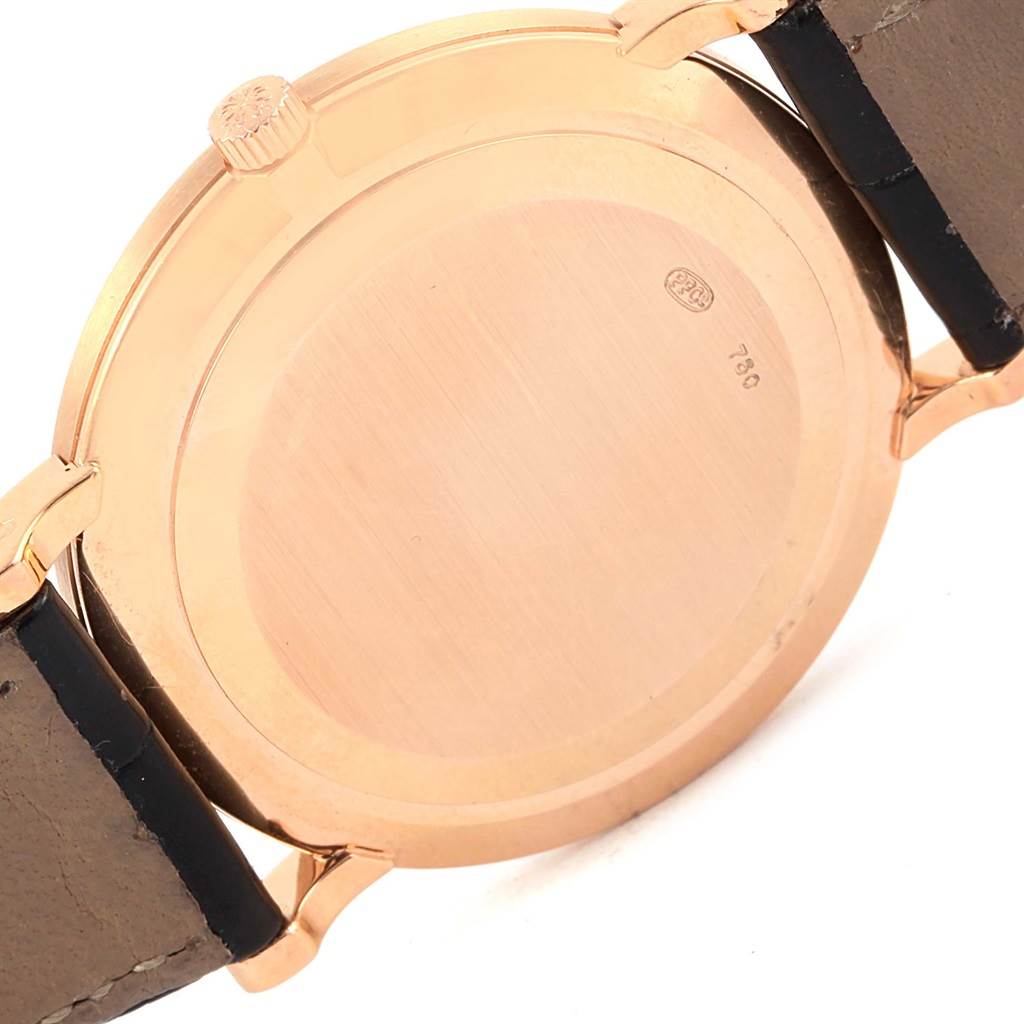 The image shows the back case and part of the strap of a Patek Philippe Calatrava 3919 Men's Rose Gold White Dial 3919 Men's Rose Gold White Dial watch from an angled side view.