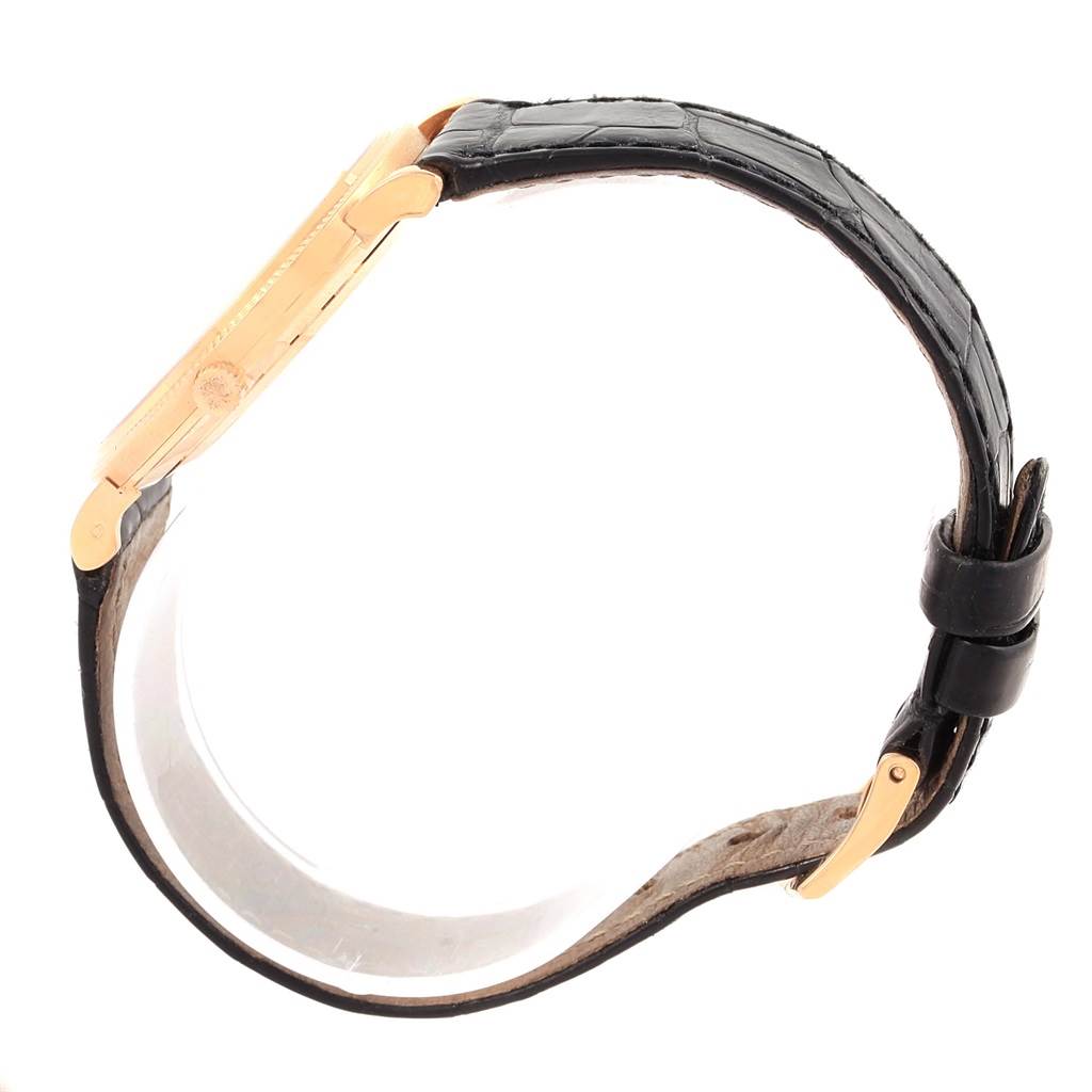 This image shows a side view of a Patek Philippe Calatrava 3919 Men's Rose Gold White Dial 3919 Men's Rose Gold White Dial watch, focusing on the case and black leather strap.