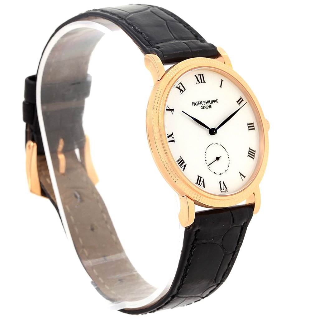 The Patek Philippe Calatrava 3919 Men's Rose Gold White Dial 3919 Men's Rose Gold White Dial watch is shown at a slight angle, displaying its face, black leather strap, and gold casing.