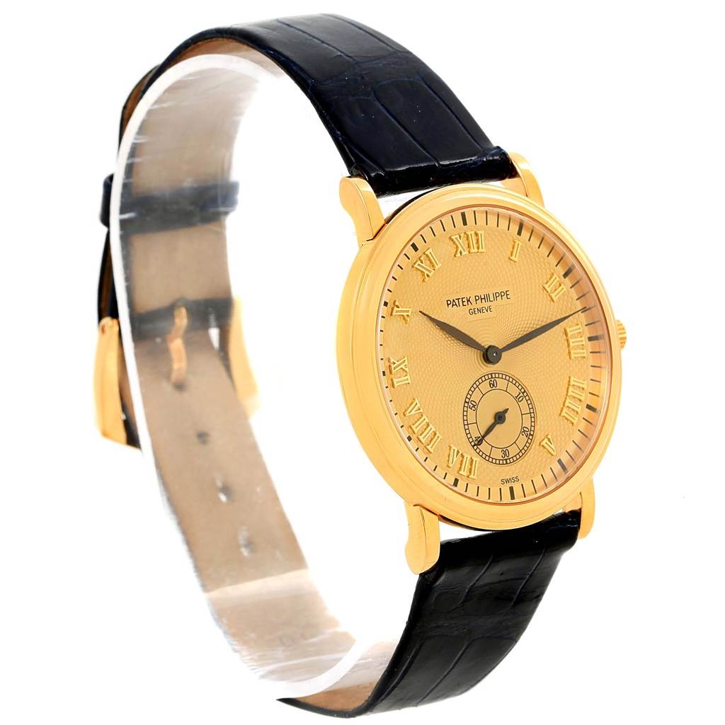 The image shows a front angled view of the Patek Philippe 5022 Yellow Gold Champagne Dial 5022 Yellow Gold Champagne Dial Calatrava Officier Yellow Gold Manual Wind Watch 5022, displaying the watch face and strap.