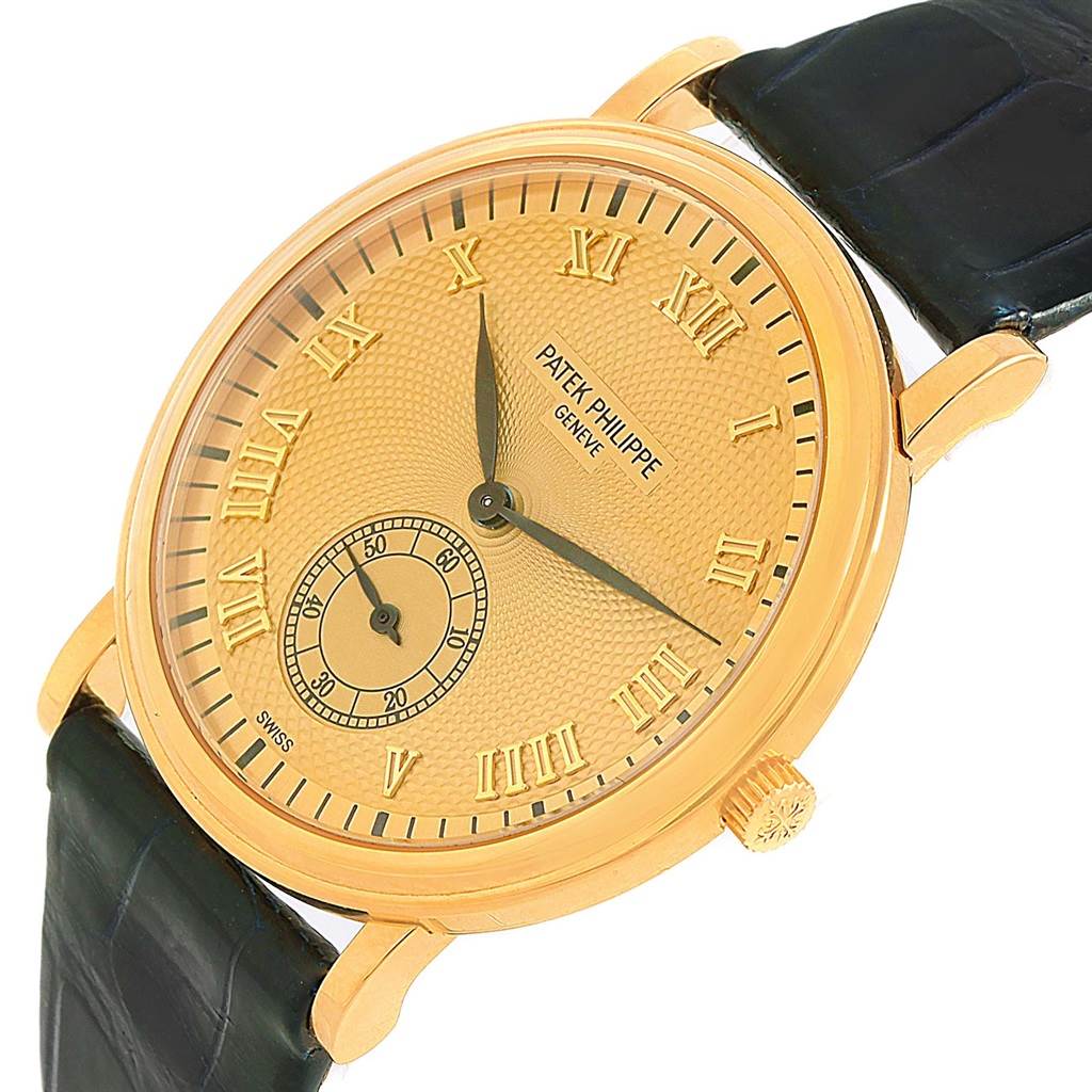 The image shows a close-up, angled view of the face and part of the strap of the Patek Philippe 5022 Yellow Gold Champagne Dial 5022 Yellow Gold Champagne Dial Calatrava Officier Yellow Gold Manual Wind Watch 5022.
