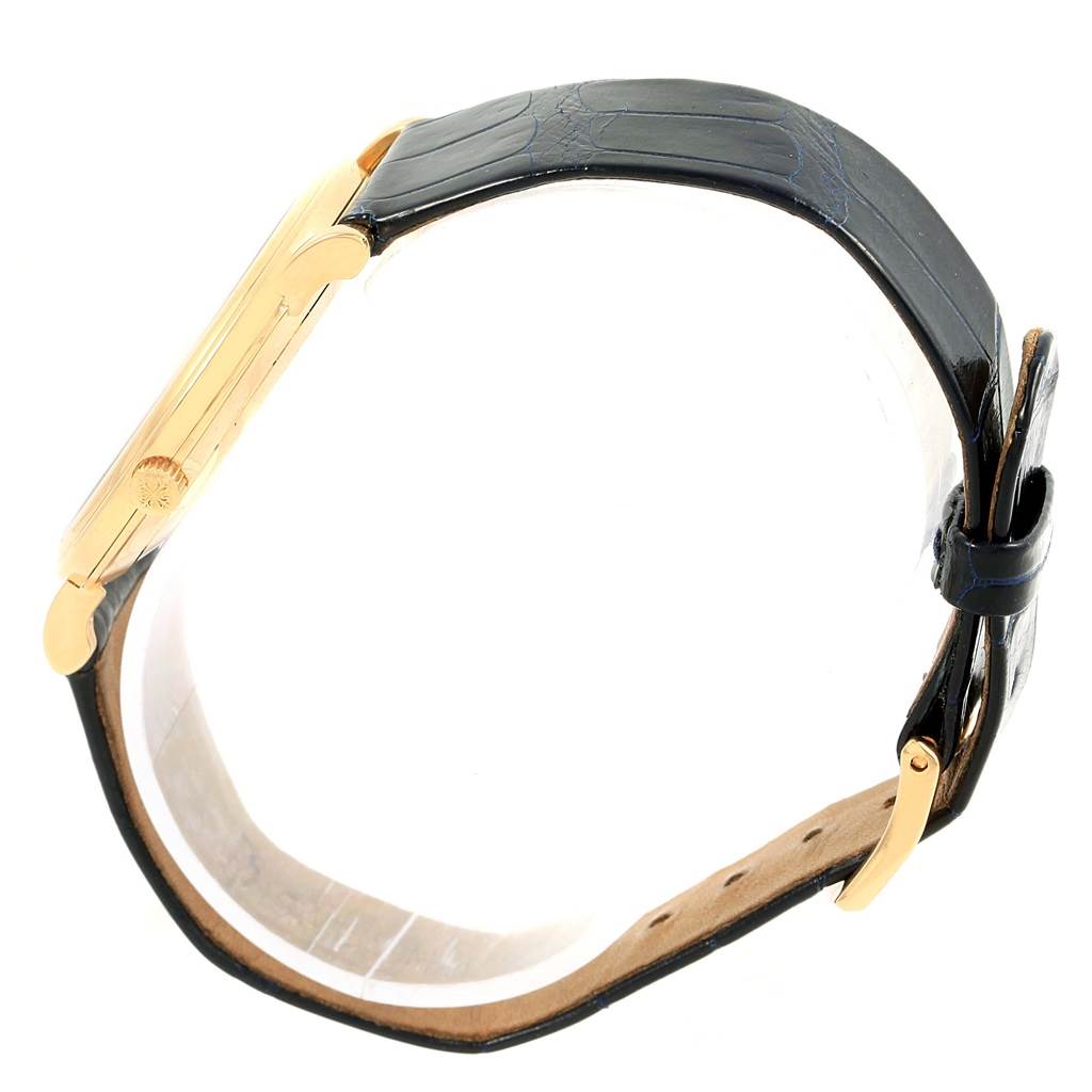 The image shows a side view of a Patek Philippe 5022 Yellow Gold Champagne Dial 5022 Yellow Gold Champagne Dial Calatrava Officier Yellow Gold Manual Wind Watch 5022 model, focusing on the case and strap.