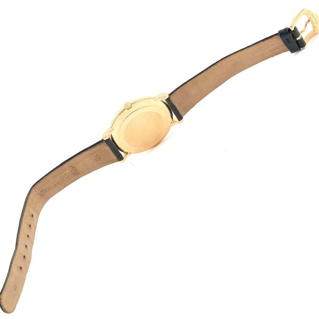 The image shows the back and strap of a Patek Philippe 5022 Yellow Gold Champagne Dial 5022 Yellow Gold Champagne Dial Calatrava Officier Yellow Gold Manual Wind Watch 5022 model.