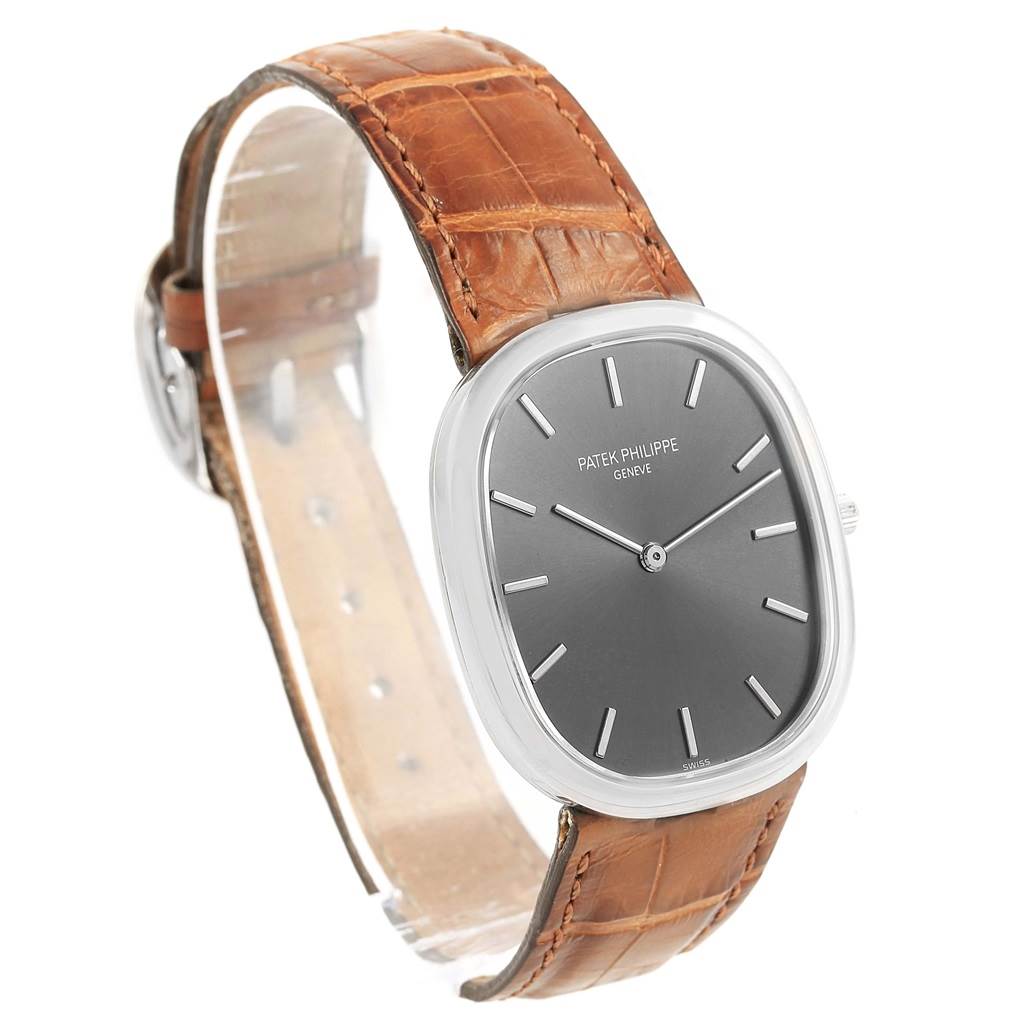 The image shows a Patek Philippe Golden Ellipse 3738 Men's White Gold Grey Dial 3738 Men's White Gold Grey Dial watch at a three-quarter front angle with a brown leather strap and a gray dial.