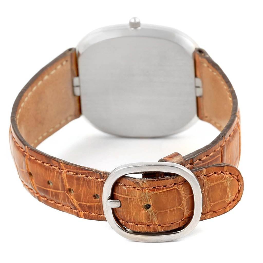 The image shows the back view of the Patek Philippe Golden Ellipse 3738 Men's White Gold Grey Dial 3738 Men's White Gold Grey Dial watch, highlighting its leather strap and buckle.