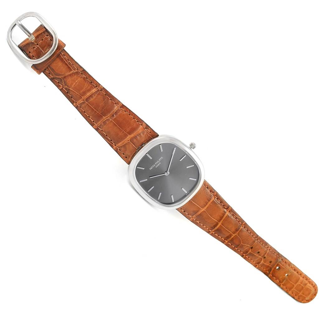 This image shows a top view of the Patek Philippe Golden Ellipse 3738 Men's White Gold Grey Dial 3738 Men's White Gold Grey Dial watch, displaying the watch face and brown leather strap.