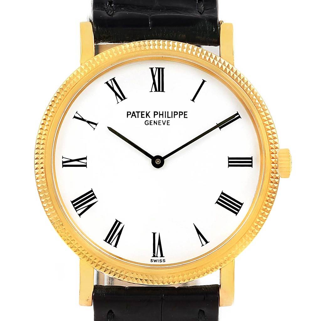 The image shows a frontal view of a Patek Philippe Calatrava 5120J Men's Yellow Gold White Dial 5120J Men's Yellow Gold White Dial watch with a gold case, white dial, and Roman numerals.