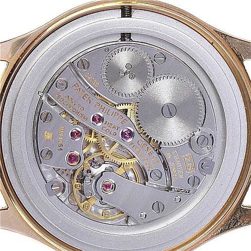 This image shows the movement and internal mechanisms of the Patek Philippe Calatrava 3923 Men's Rose Gold Silver Dial 3923 Men's Rose Gold Silver Dial watch from a rear angle.