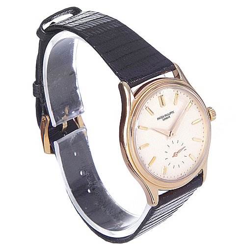 The image shows a side view of a Patek Philippe Calatrava 3923 Men's Rose Gold Silver Dial 3923 Men's Rose Gold Silver Dial watch, highlighting the face, strap, and buckle.