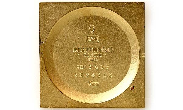 This is the inner case back of a vintage Patek Philippe watch, showing brand markings, reference, and serial numbers.