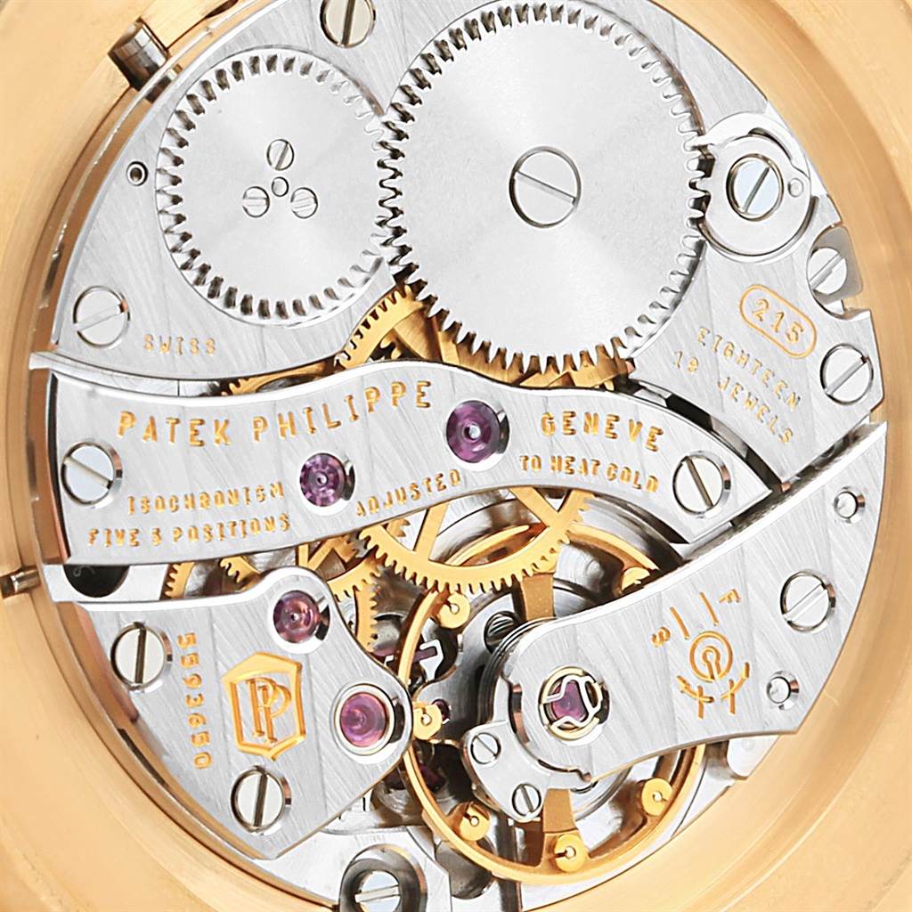 This image shows the intricate inner movement of a Patek Philippe Calatrava 5119J Men's Yellow Gold White Dial 5119J Men's Yellow Gold White Dial watch.