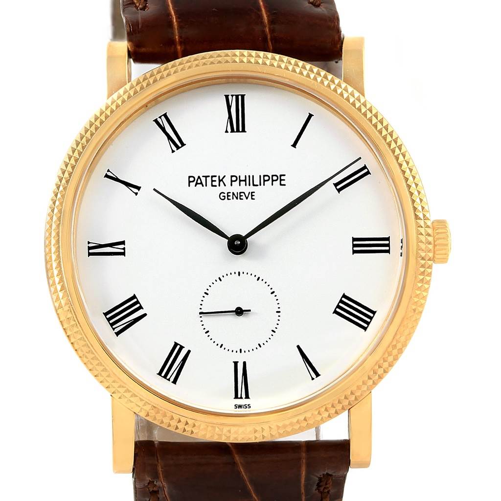 The image shows a front view of the Patek Philippe Calatrava 5119J Men's Yellow Gold White Dial 5119J Men's Yellow Gold White Dial watch, highlighting the dial, hands, bezel, and leather strap.
