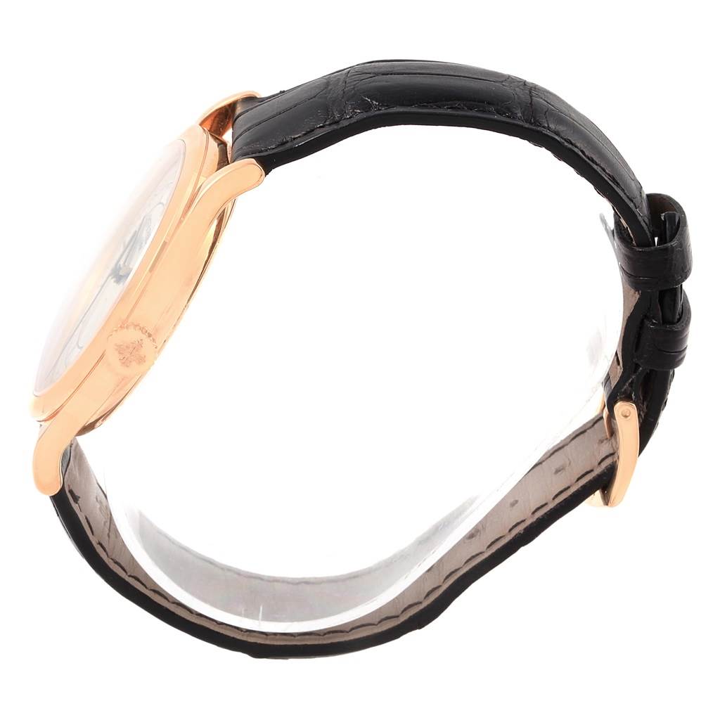 The image shows the profile view of a Patek Philippe Calatrava 5296R-001 Men
s Rose Gold Silver Dial 5296R-001 Men
s Rose Gold Silver Dial watch, highlighting its case and leather strap.