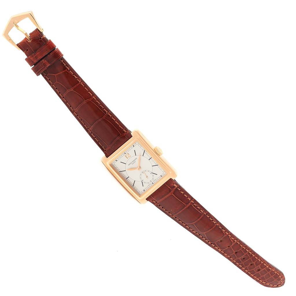 The Patek Philippe Gondolo 5010R Men's Rose Gold Silver Dial 5010R Men's Rose Gold Silver Dial watch is shown in a top-down view, displaying the face, case, crown, and brown leather strap.