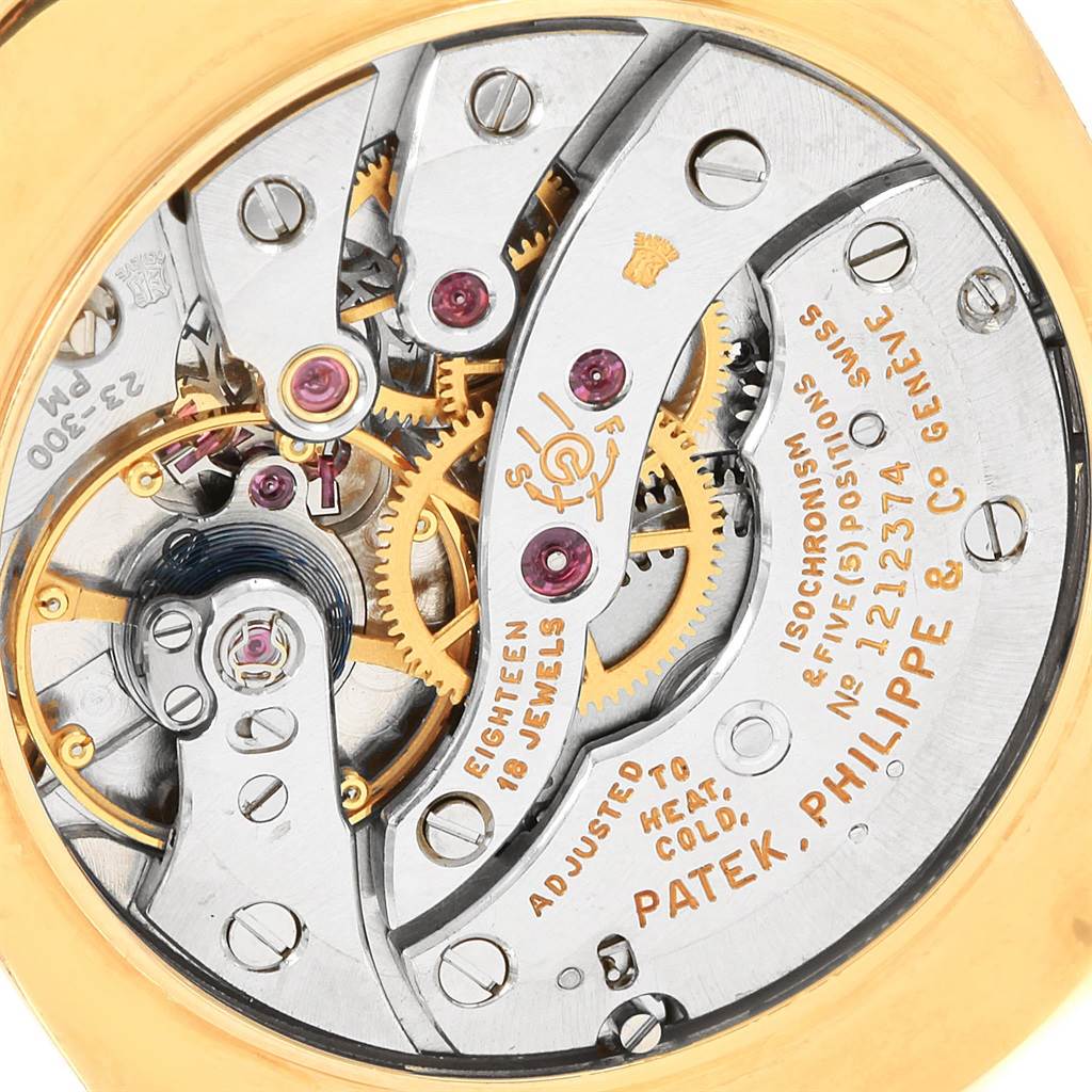 This image shows the intricate inner mechanical movement of a Patek Philippe Golden Ellipse 3546 Men's Yellow Gold Champagne Dial 3546 Men's Yellow Gold Champagne Dial watch from a close-up angle.