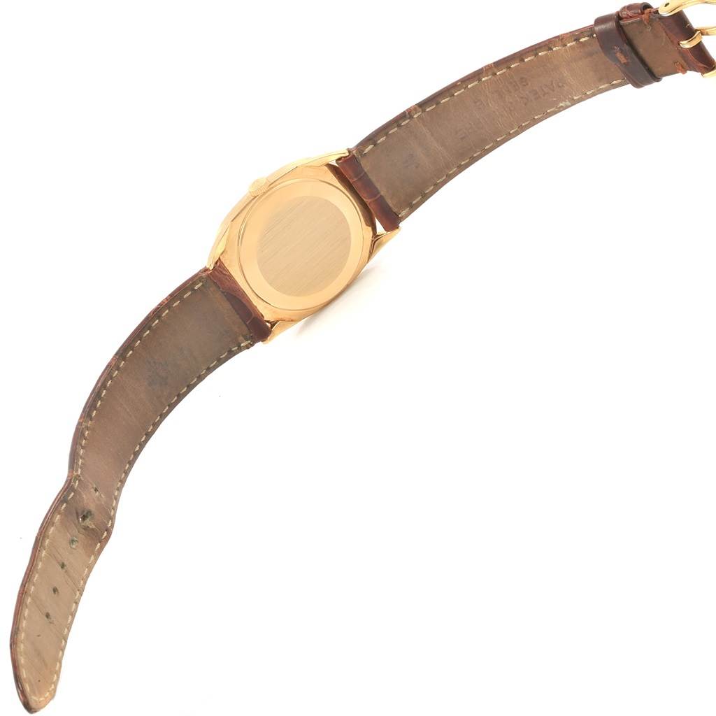 The image shows the back view of a Patek Philippe Golden Ellipse 3546 Men's Yellow Gold Champagne Dial 3546 Men's Yellow Gold Champagne Dial watch, displaying its case and leather strap.