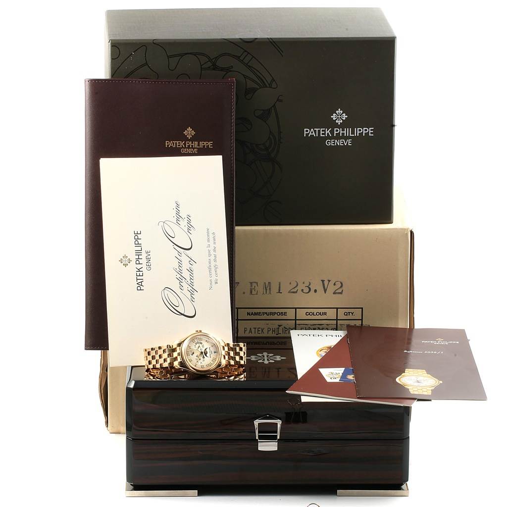 The image shows a Patek Philippe 5036 Men's Yellow Gold White Dial 5036 Men's Yellow Gold White Dial Annual Calendar Moonphase Yellow Gold Watch 5036 with its box, papers, and accessories in a frontal angle view.