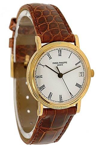 The image shows a Patek Philippe Calatrava 3802/200 Men's Yellow Gold White Dial 3802/200 Men's Yellow Gold White Dial watch at a three-quarter angle, highlighting the dial, bezel, and leather strap.