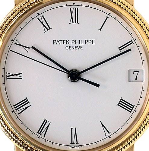 The image shows a close-up view of the Patek Philippe Calatrava 3802/200 Men's Yellow Gold White Dial 3802/200 Men's Yellow Gold White Dial watch face with Roman numerals and a date window.