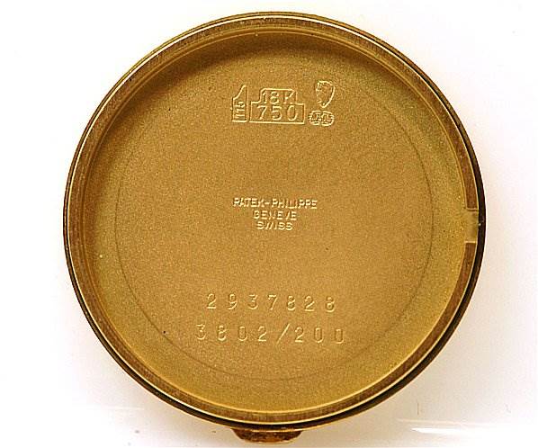 The image shows the inner case back of a Patek Philippe Calatrava 3802/200 Men's Yellow Gold White Dial 3802/200 Men's Yellow Gold White Dial watch laid flat.