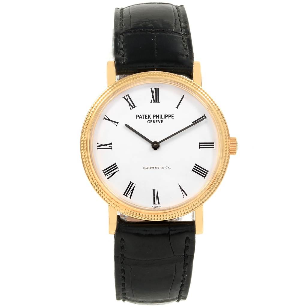 This image shows a front view of a Patek Philippe Calatrava 5120J Men's Yellow Gold White Dial 5120J Men's Yellow Gold White Dial watch with a black leather strap and gold case.