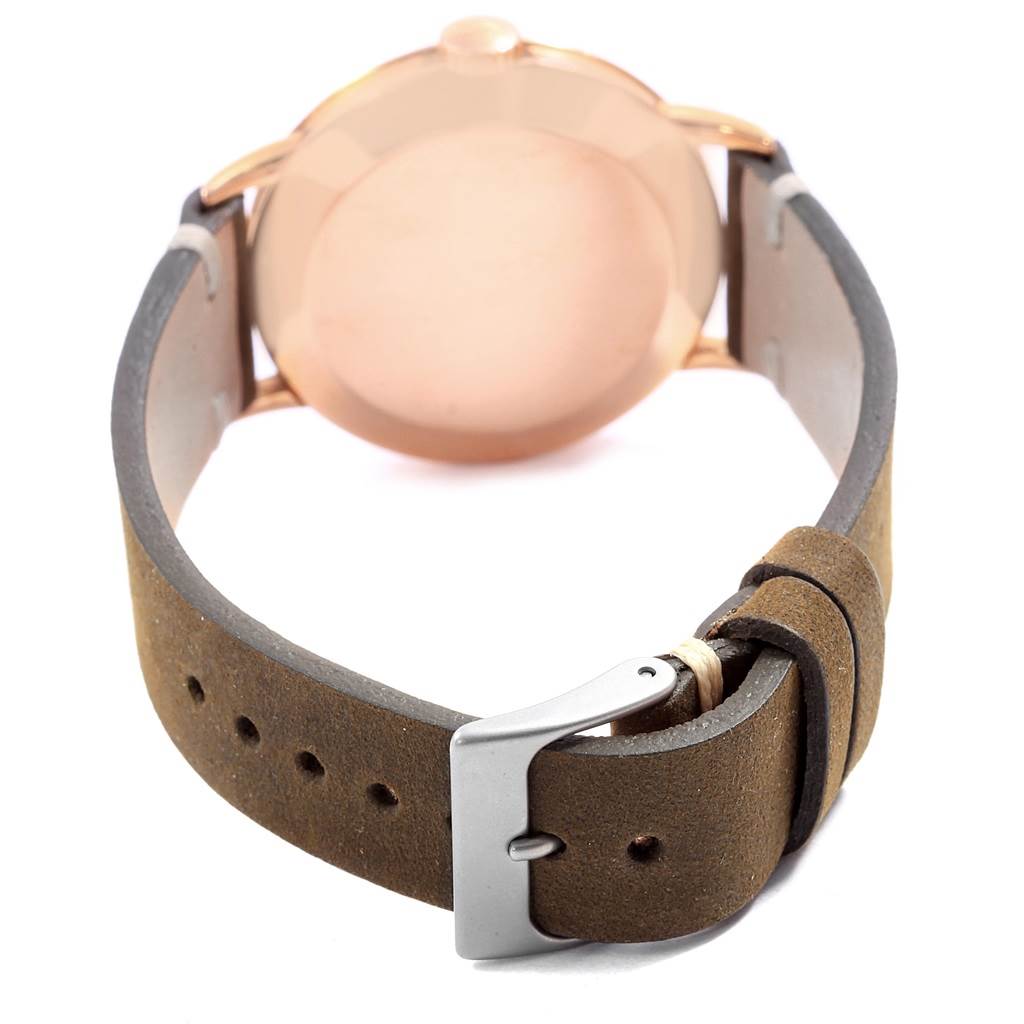 The image shows the back view of a Vintage Patek Philippe watch, focusing on its case and leather strap with buckle.