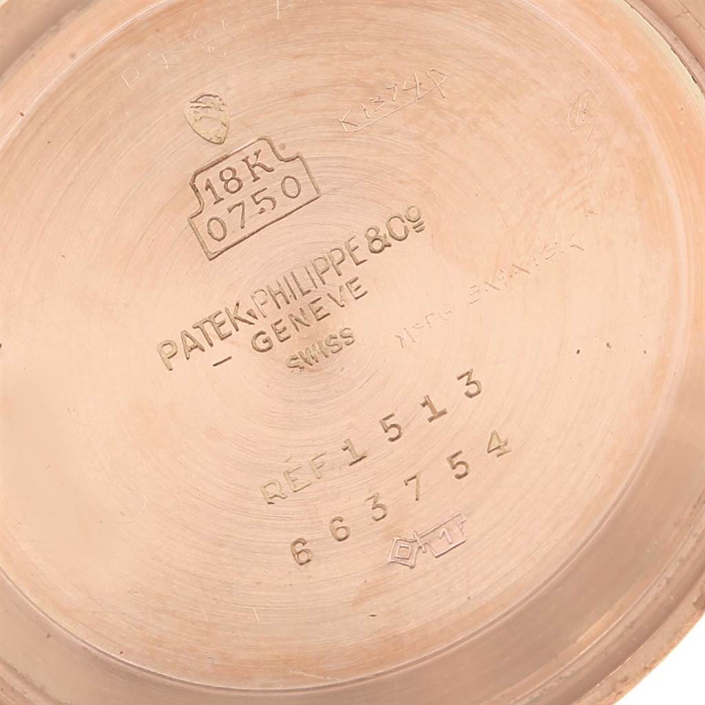 This is a close-up of the inner case back of a vintage Patek Philippe watch model 1513, showing the brand details and gold purity mark.