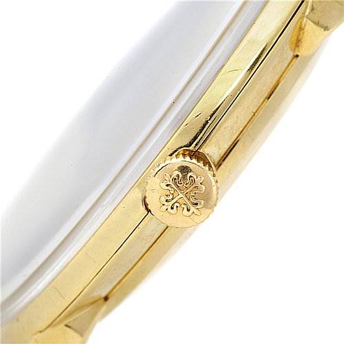 This image shows a side view of the crown and case of a vintage Patek Philippe watch.