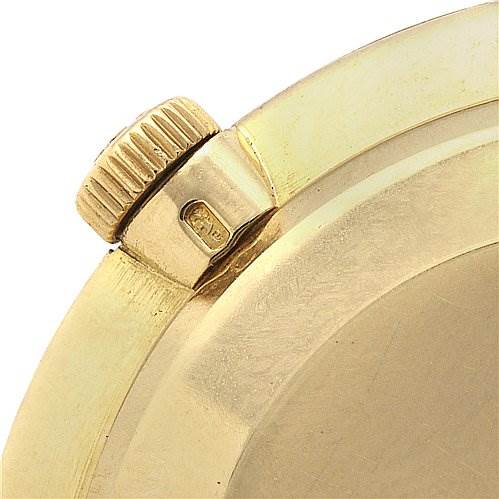 This is a close-up of the crown and case of a vintage Patek Philippe watch.