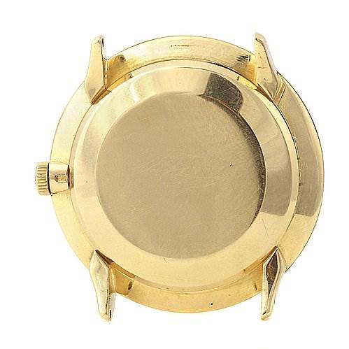 This image shows the back case of a Vintage Patek Philippe watch with lugs and crown visible.