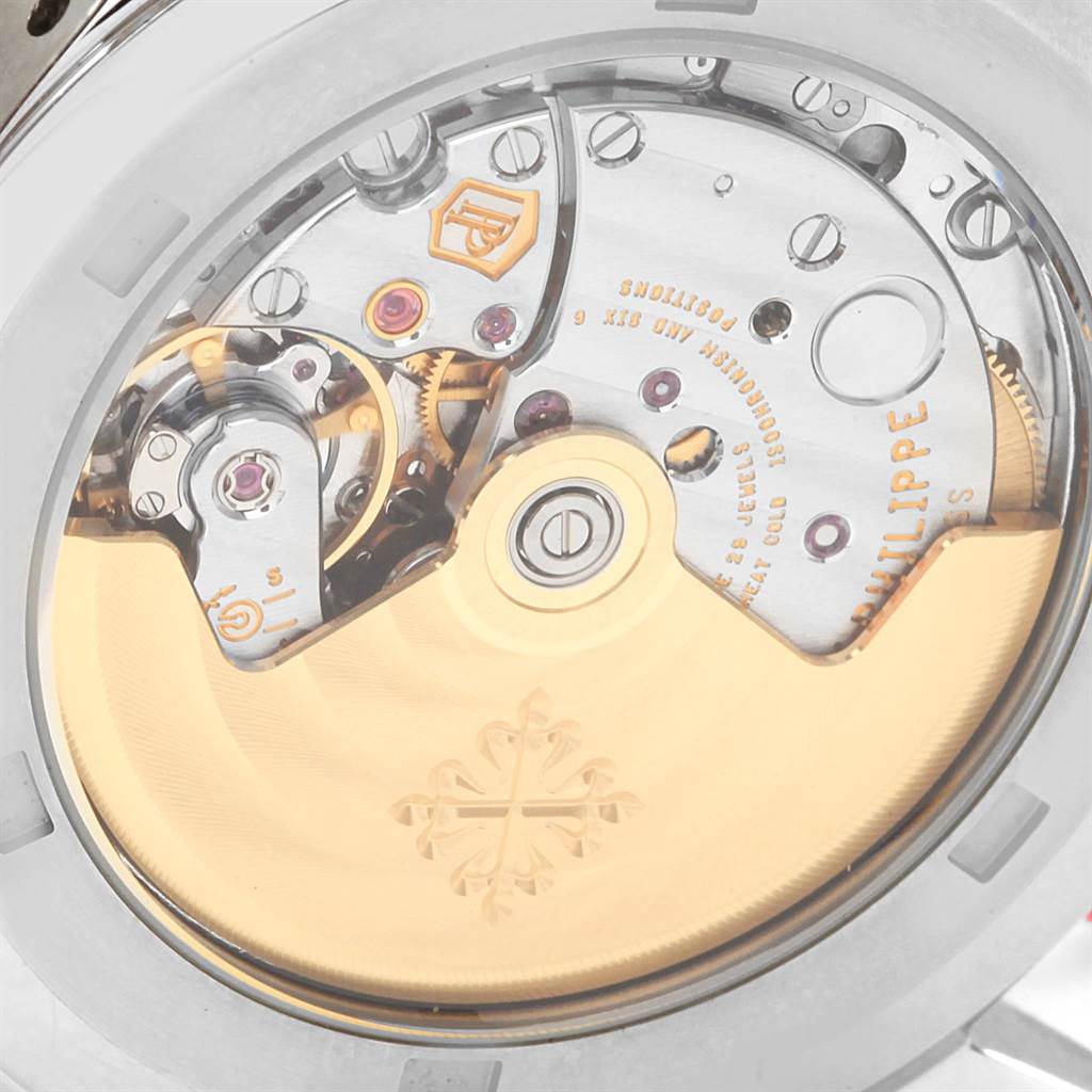 The image shows the intricate mechanics and movement of the Patek Philippe Aquanaut 5164A Men's Stainless Steel Black Dial 5164A Men's Stainless Steel Black Dial watch from a rear angle.