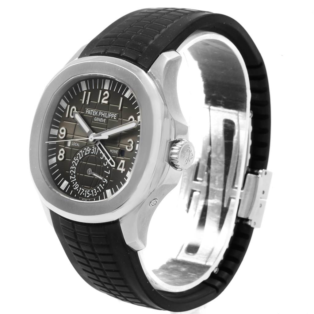 The image shows a side angle of a Patek Philippe Aquanaut 5164A Men's Stainless Steel Black Dial 5164A Men's Stainless Steel Black Dial watch including the face, bezel, crown, and a portion of the strap and clasp.