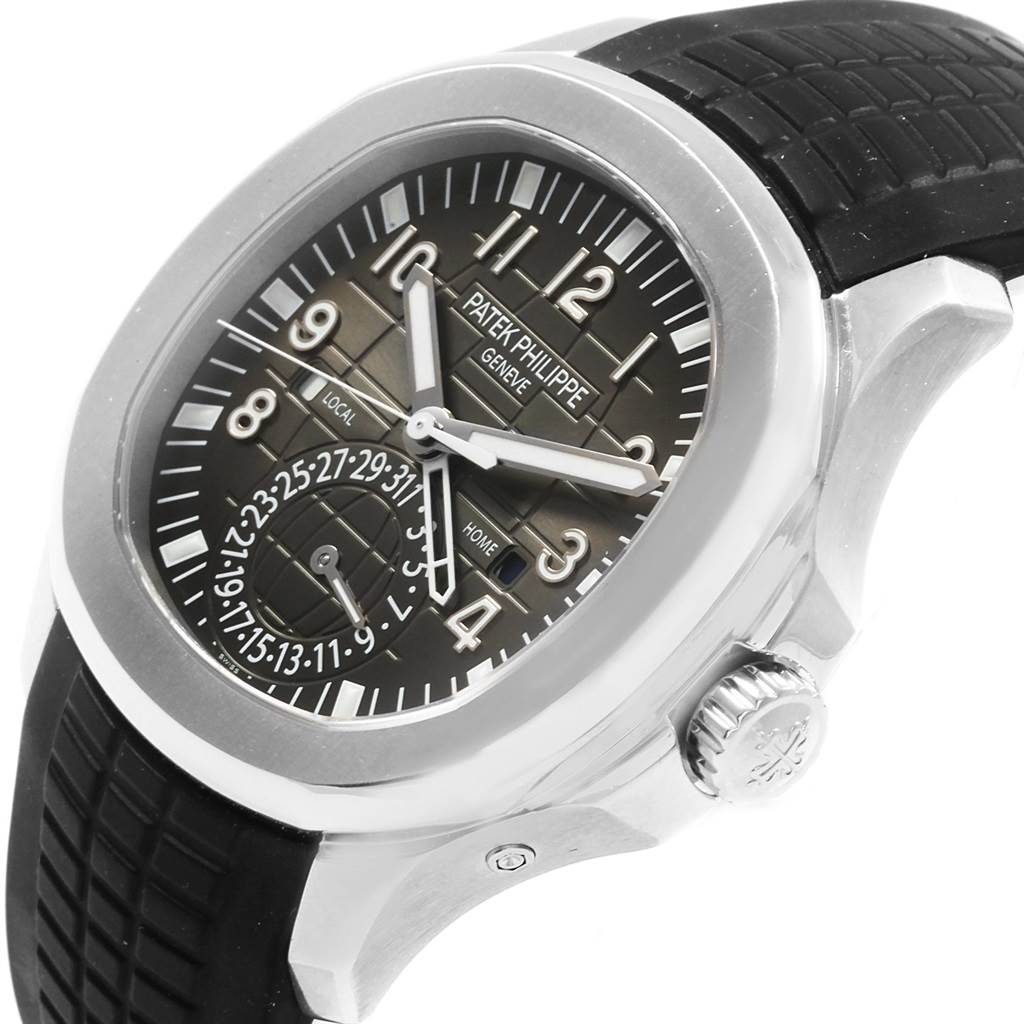 The image shows a side view of the Patek Philippe Aquanaut 5164A Men's Stainless Steel Black Dial 5164A Men's Stainless Steel Black Dial watch, highlighting its dial, bezel, crown, and black strap.