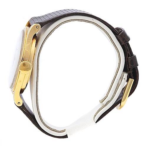 This is a side view of a Vintage Patek Philippe watch, showing the gold case, crown, and brown leather strap.